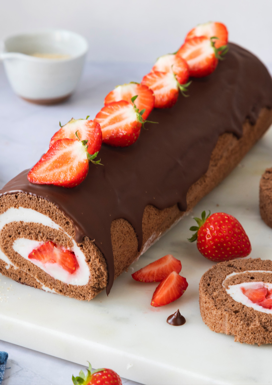 Chocolate-sponge-roll with strawberries